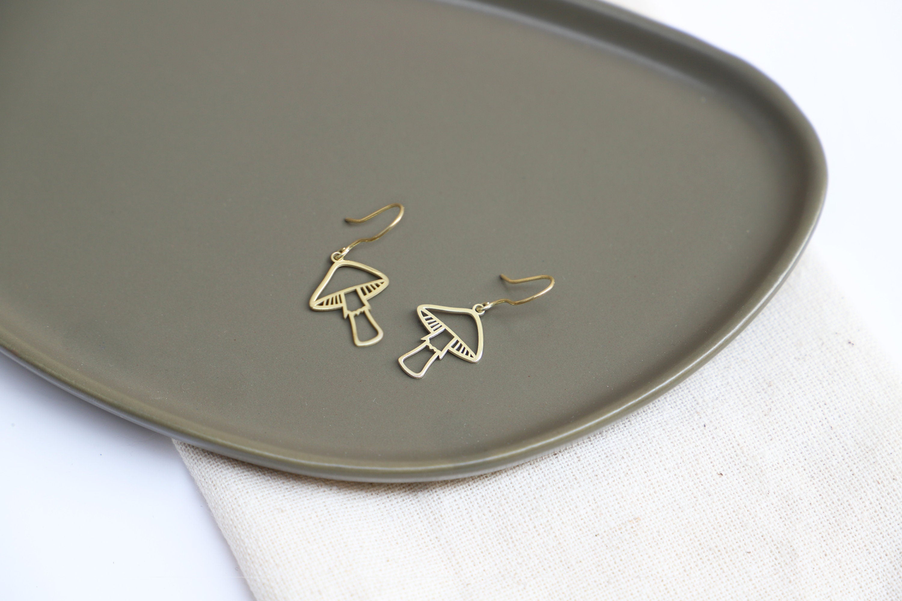 Gleaming Gold Dangle Earrings with Enchanting Mushroom Design